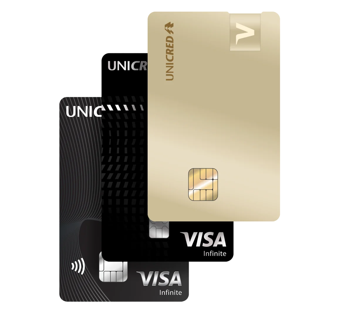 Cartões Unicred Visa Infinite e Gold empilhados.